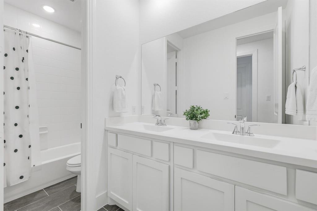 4608 Mount Vista Road Oak Point, TX 75068 - Photo 34 of 39 Dual vanity with white cabinetry and integrated sinks