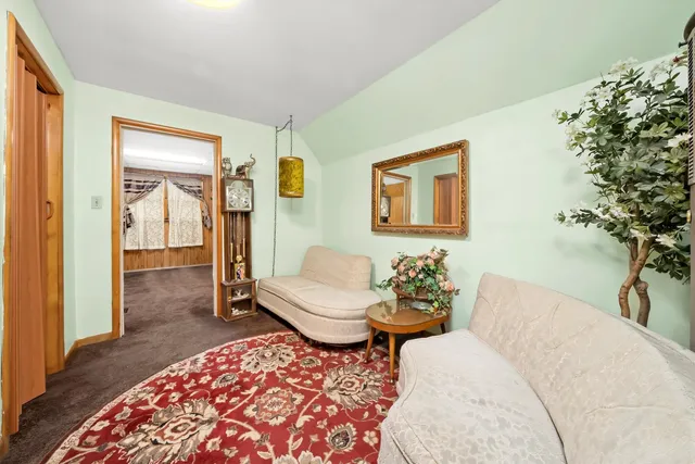 a living room with furniture and a rug