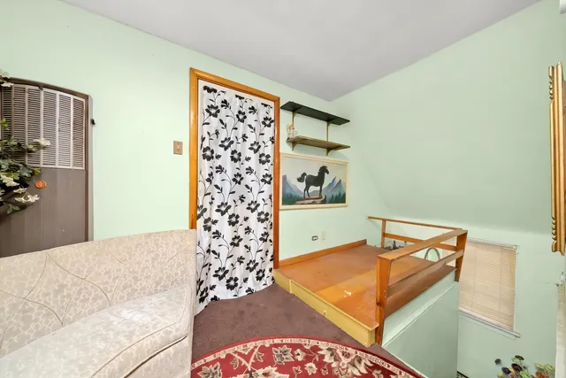 a bedroom with a bed and a cabinets