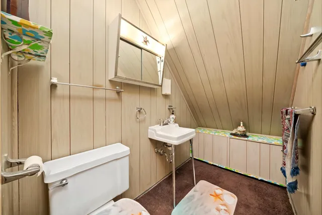 a bathroom with a sink a toilet and tub
