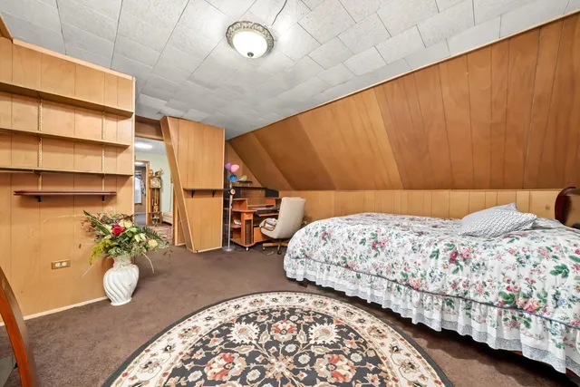 a bedroom with bed and a window