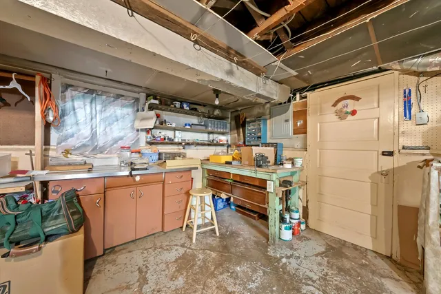 a utility room with cabinets dryer and washer