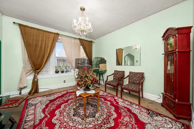 a bed room with a bed and a chair