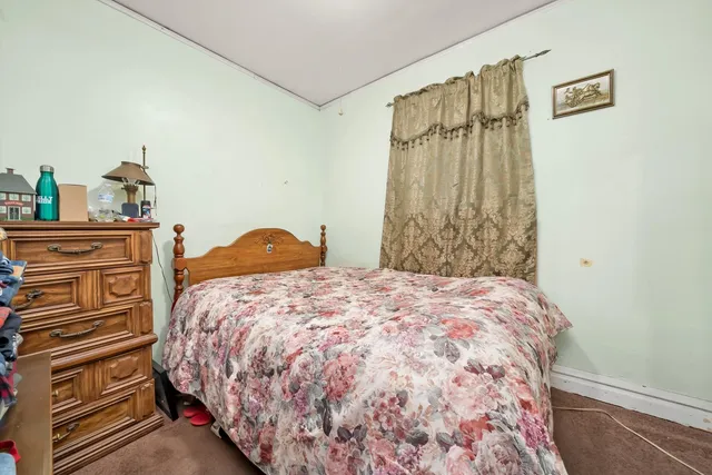 a bedroom with a bed and a closet