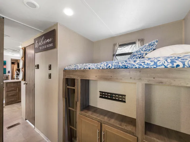 a kitchen with a stove and refrigerator