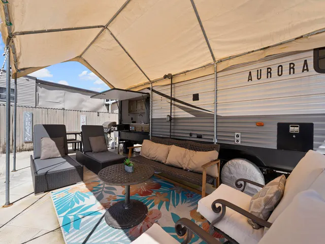 a backyard of a house with seating space