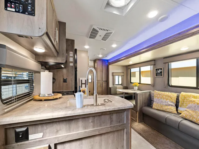 a view of living room with granite countertop furniture and fireplace