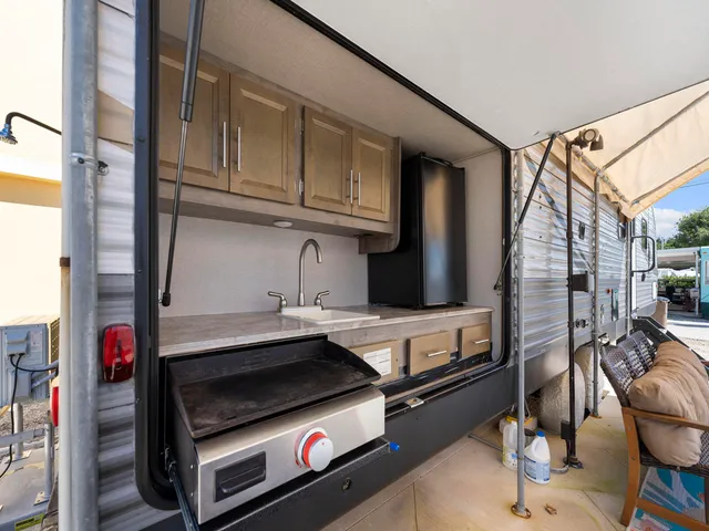 a utility room with multiple dryer and washer