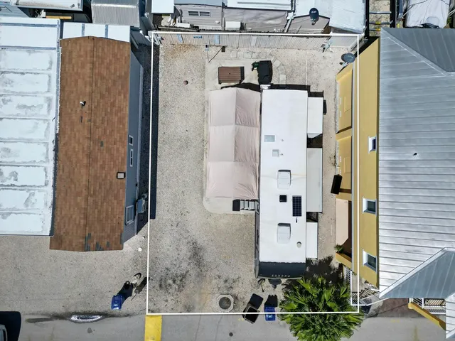 a front view of a house with outdoor seating