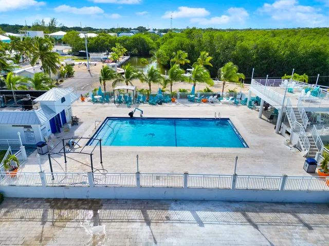 a view of a swimming pool with a patio