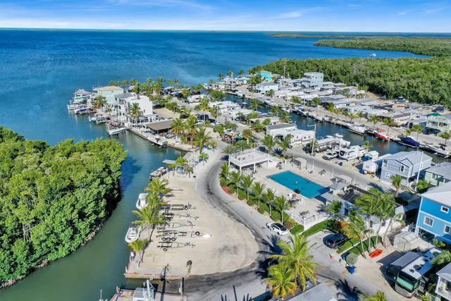an aerial view of a house with a ocean view