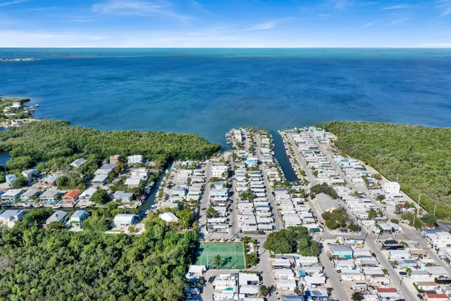 an aerial view of residential building with ocean view