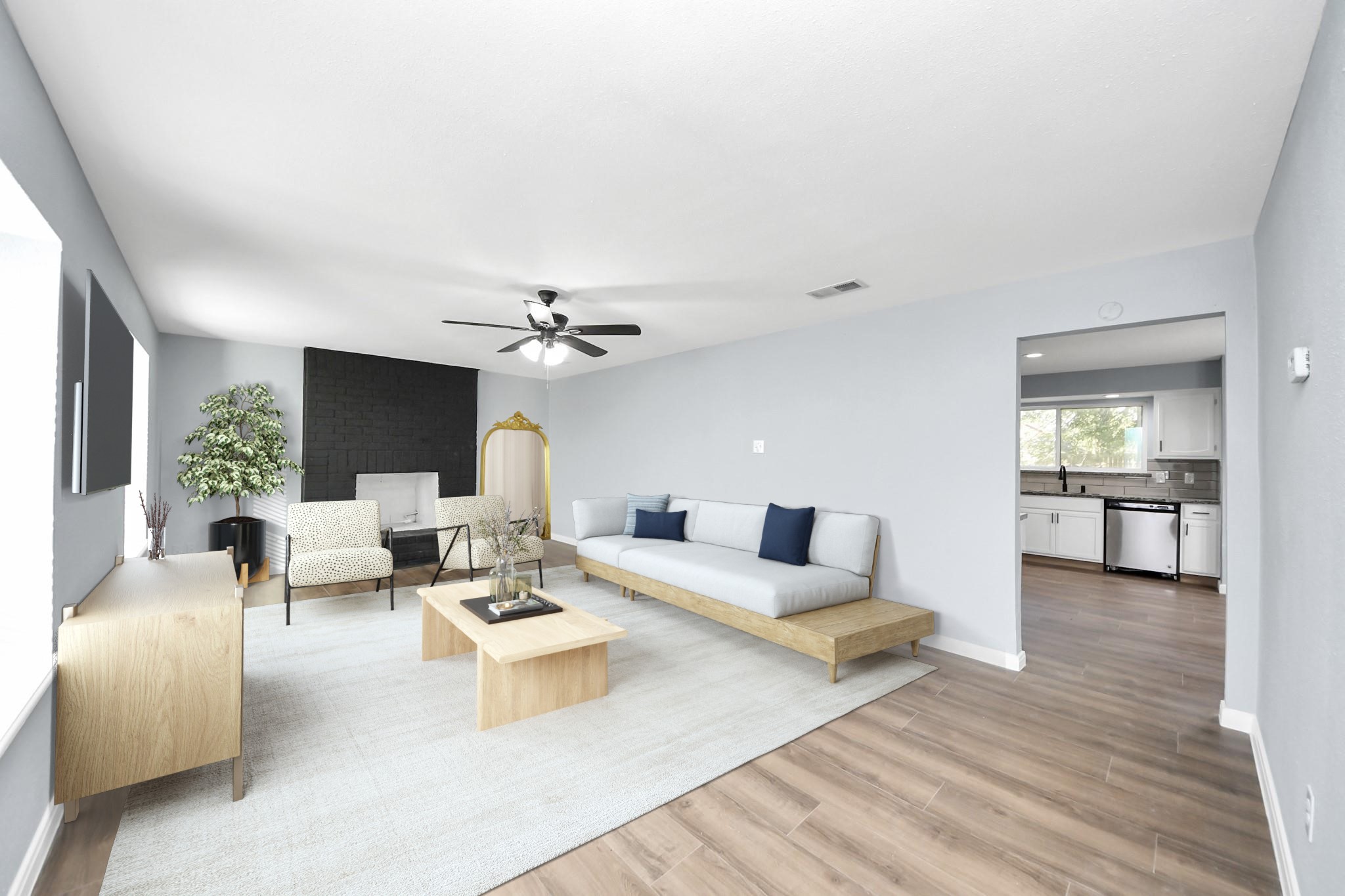 a living room with furniture and a wooden floor