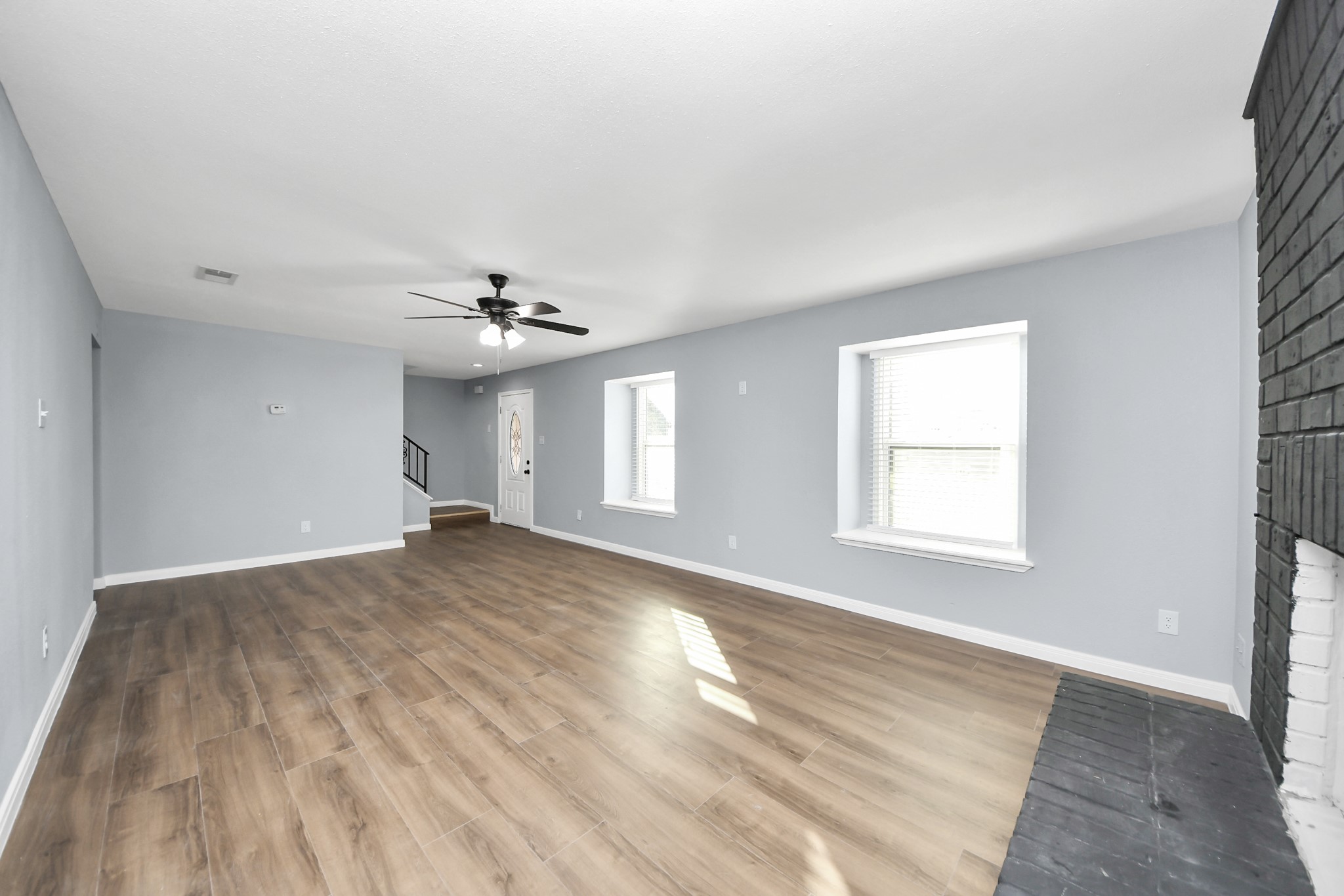 1806 Lacewing Lane Houston, TX 77067 - Photo 12 of 49 wooden floor in an empty room with a window