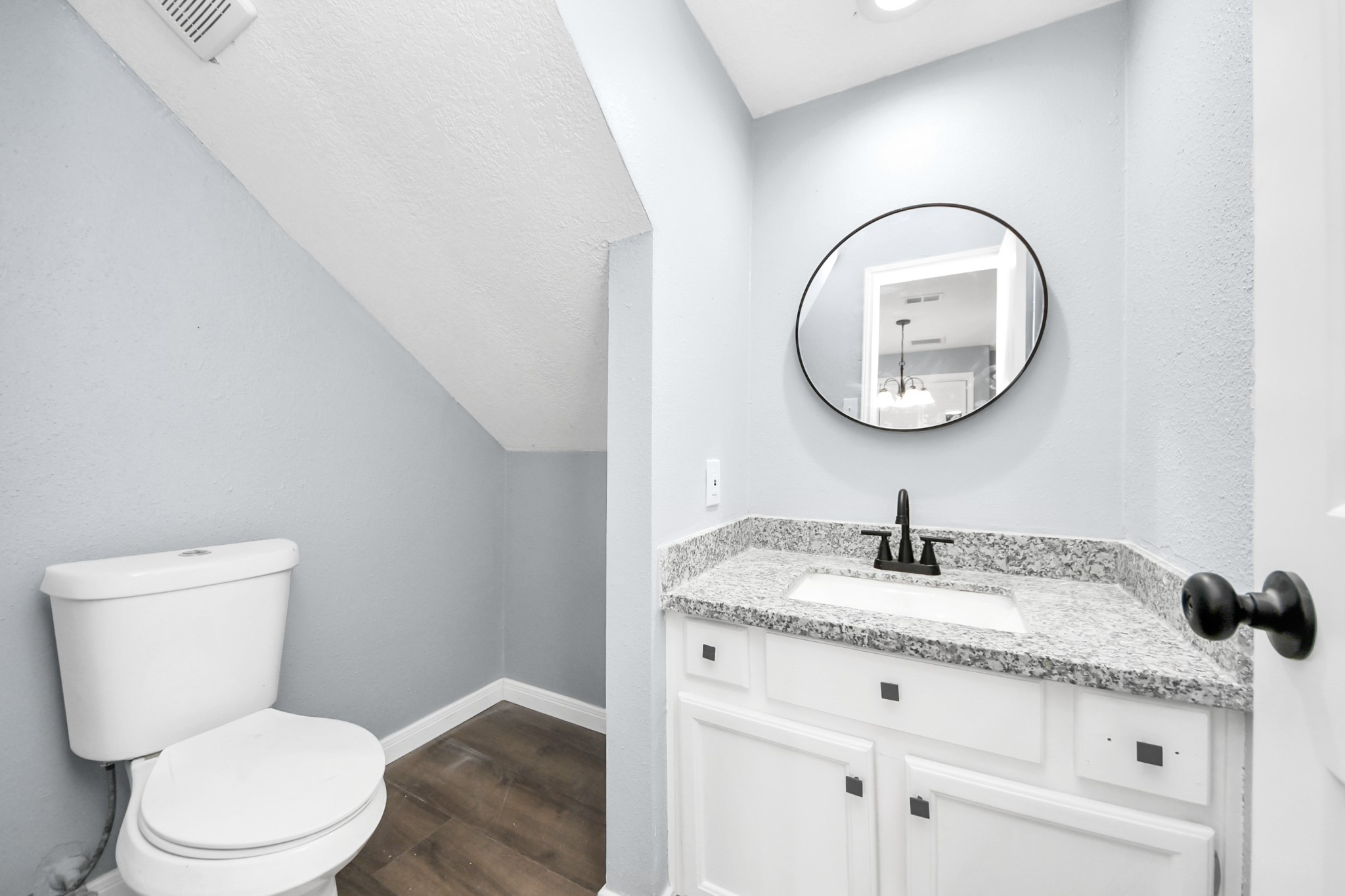 1806 Lacewing Lane Houston, TX 77067 - Photo 14 of 49 a bathroom with a granite countertop toilet sink and mirror