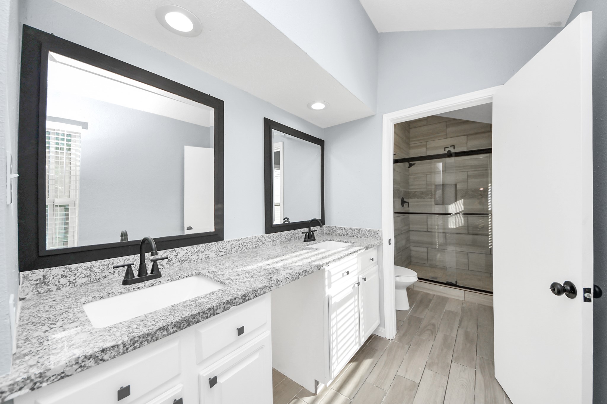 1806 Lacewing Lane Houston, TX 77067 - Photo 19 of 49 a bathroom with a granite countertop sink mirror and double