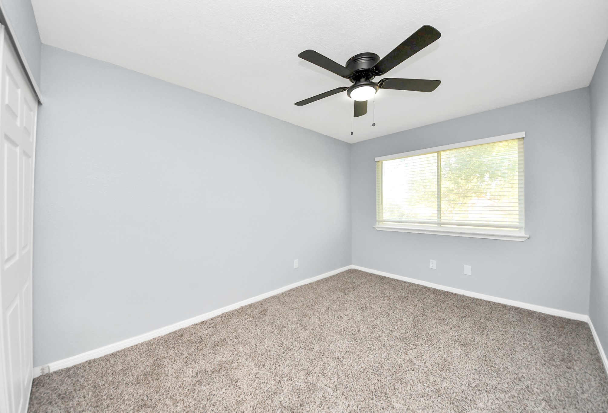 1806 Lacewing Lane Houston, TX 77067 - Photo 23 of 49 a view of a big room with wooden floor and windows