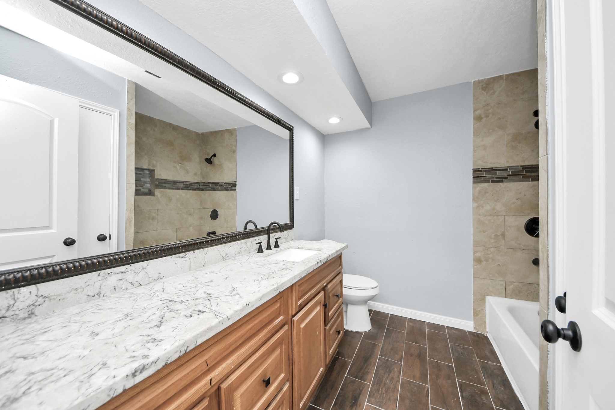 1806 Lacewing Lane Houston, TX 77067 - Photo 30 of 49 a bathroom with a sink and a mirror