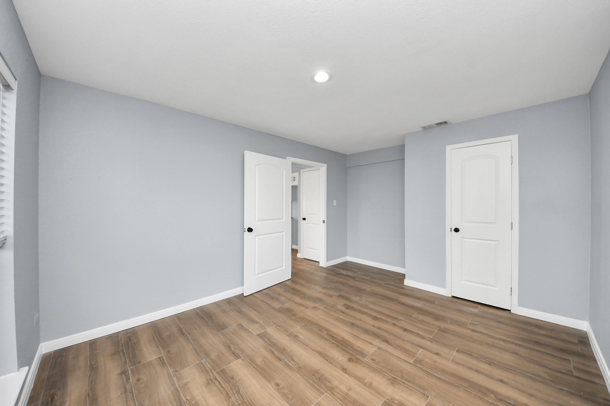 1806 Lacewing Lane Houston, TX 77067 - Photo 34 of 49 a view of an empty room and wooden floor