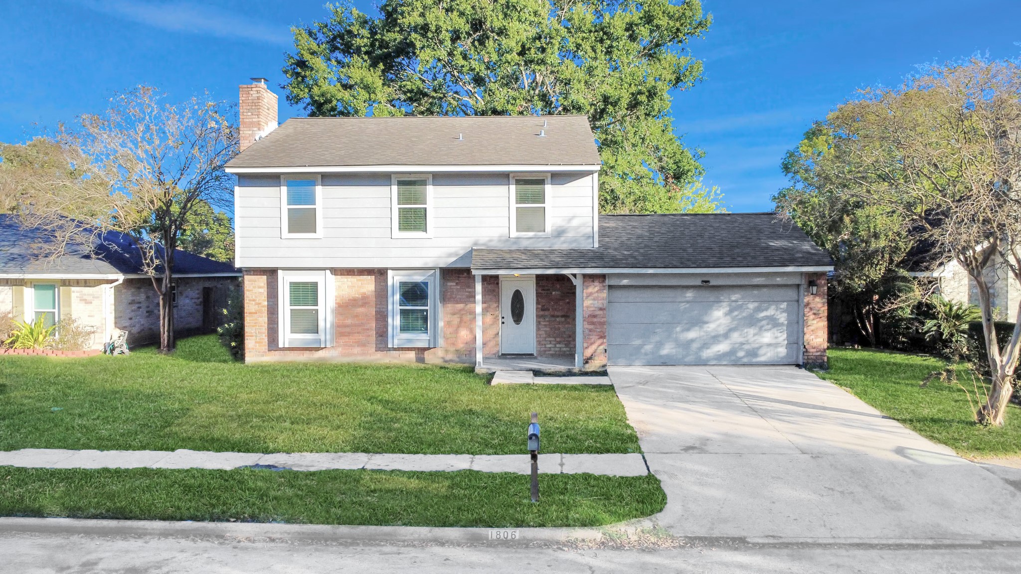1806 Lacewing Lane Houston, TX 77067 - Photo 38 of 49 a front view of a house with a garden