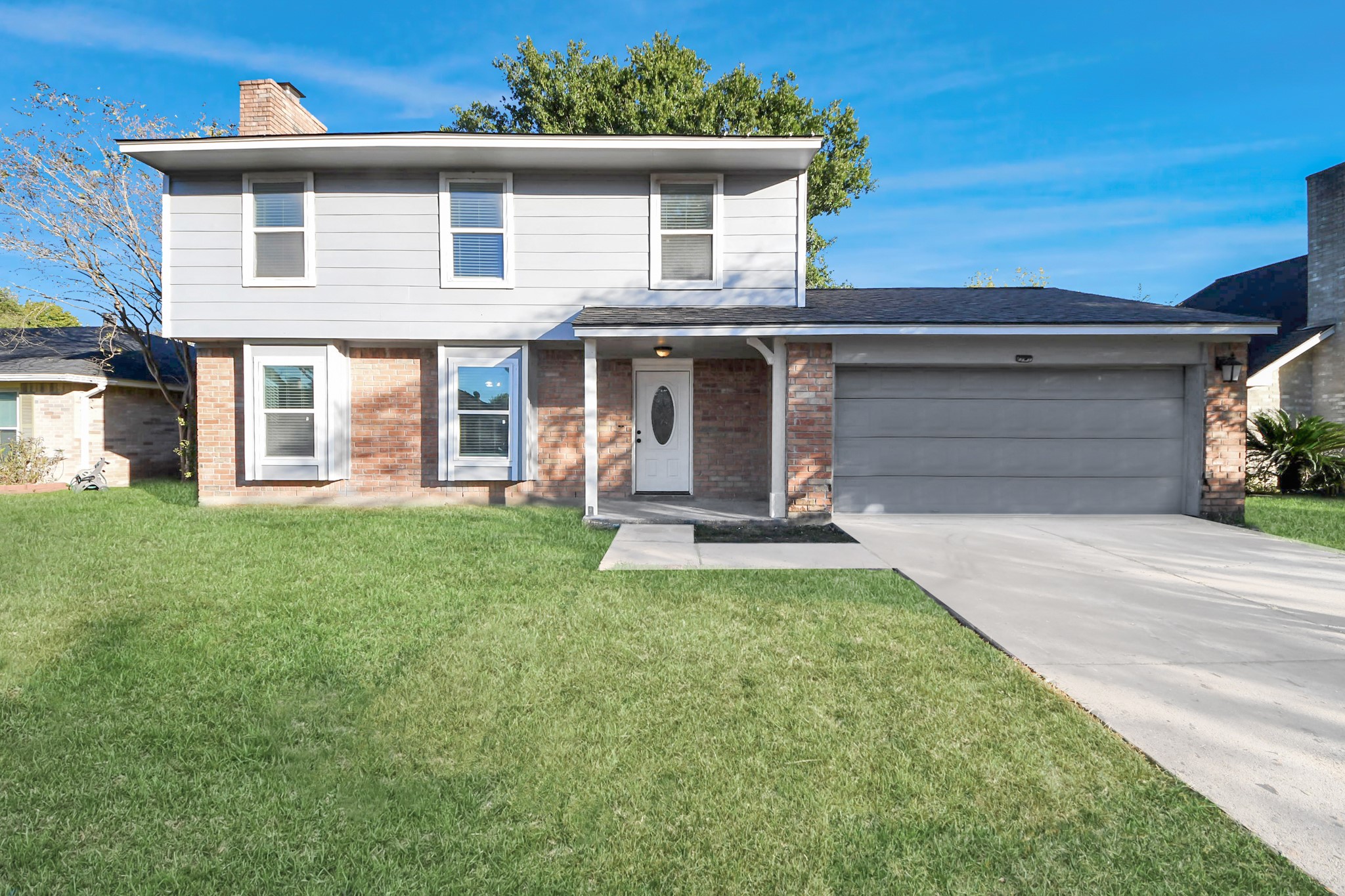 1806 Lacewing Lane Houston, TX 77067 - Photo 42 of 49 a front view of a house with a yard and garage