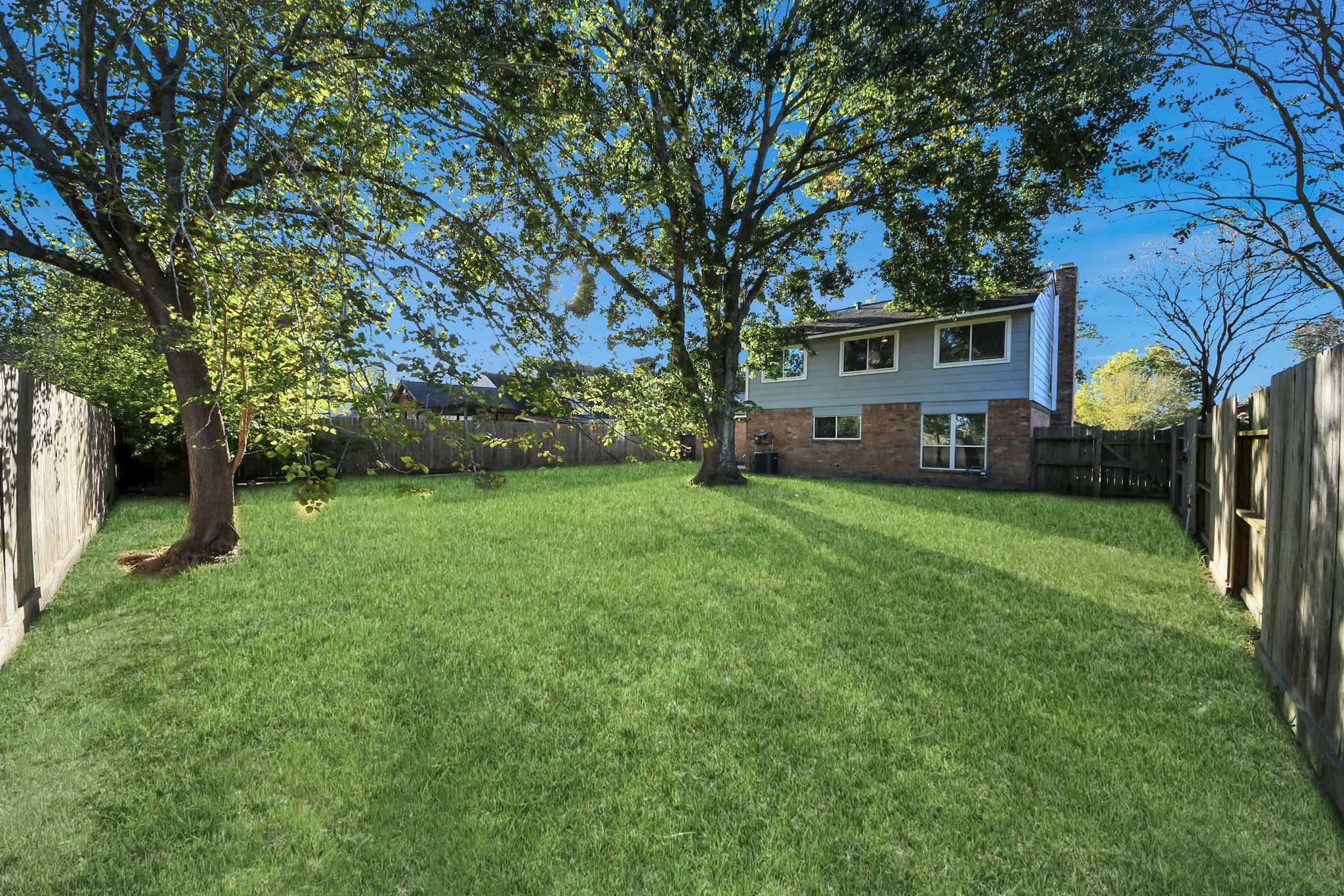 1806 Lacewing Lane Houston, TX 77067 - Photo 44 of 49 a front view of a house with a garden and tree