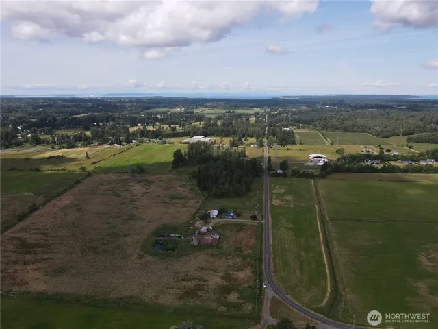 an aerial view of a houses with outdoor space