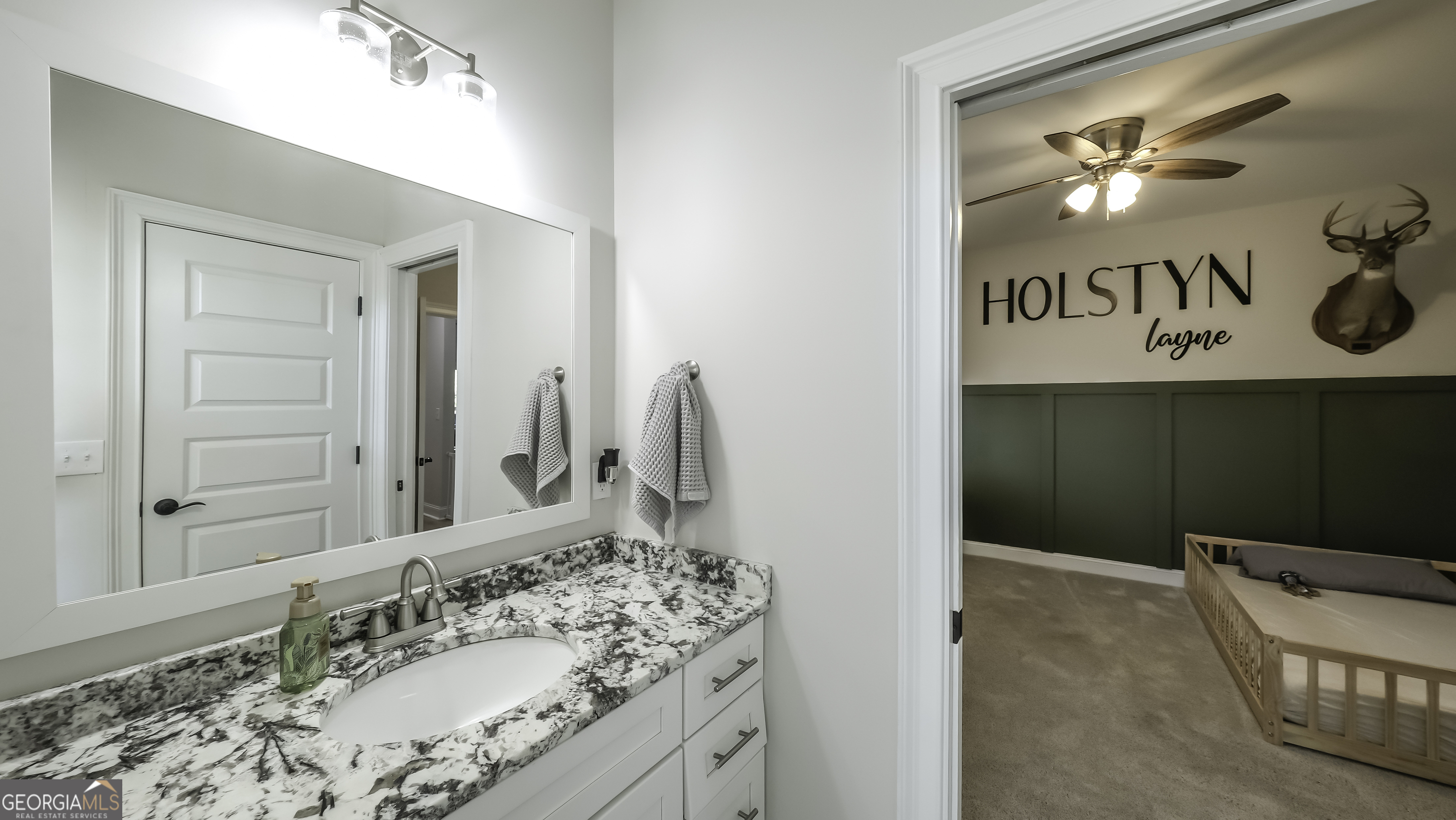 2392 Welcome Road Roopville, GA 30170 - Photo 35 of 43 a bathroom with a sink and a mirror