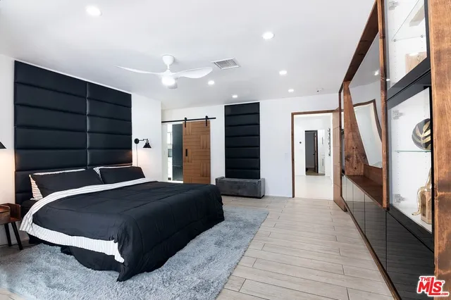 a bathroom with a shower and a sink