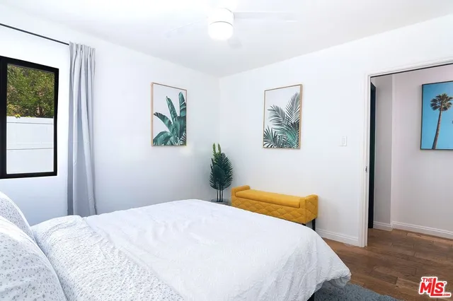a view of a patio with a table chairs and a backyard