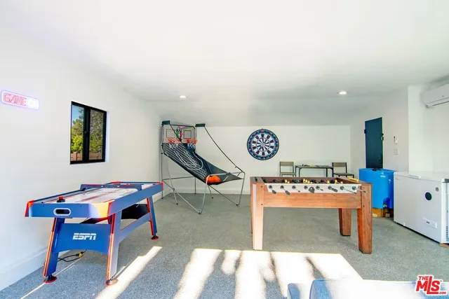a view of a house with swimming pool and sitting area