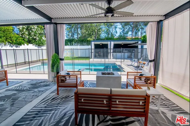 a kitchen with a sink a counter top space and a stove