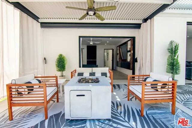 a close view of a sink a stove and a table in a kitchen