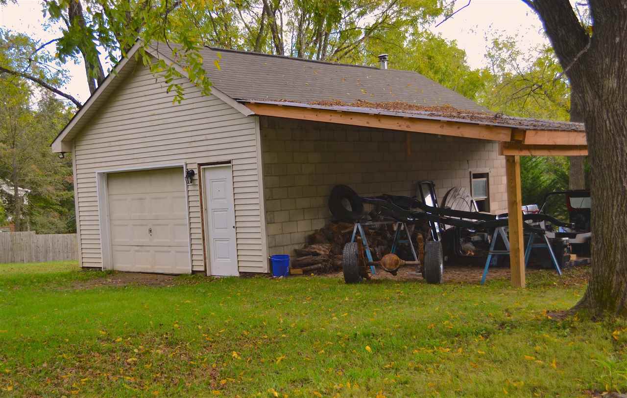 2256 Lyndhurst Road Waynesboro, VA 22980 - Photo 36 of 41 a view of a wooden house with a big yard and a large tree