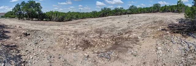a view of a road with a yard
