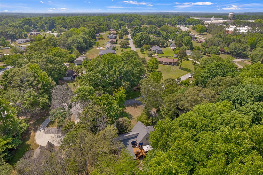 218 Northridge Drive Anderson, SC 29621 - Photo 49 of 50 An aerial perspective reveals a private wooded lot with a winding driveway and neighboring residences.