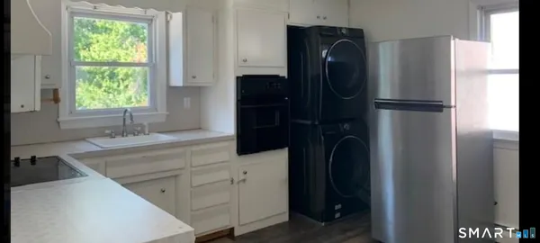 a bathroom with a double vanity sink and a large mirror