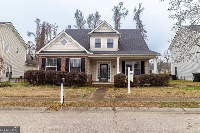 front view of a house with a yard