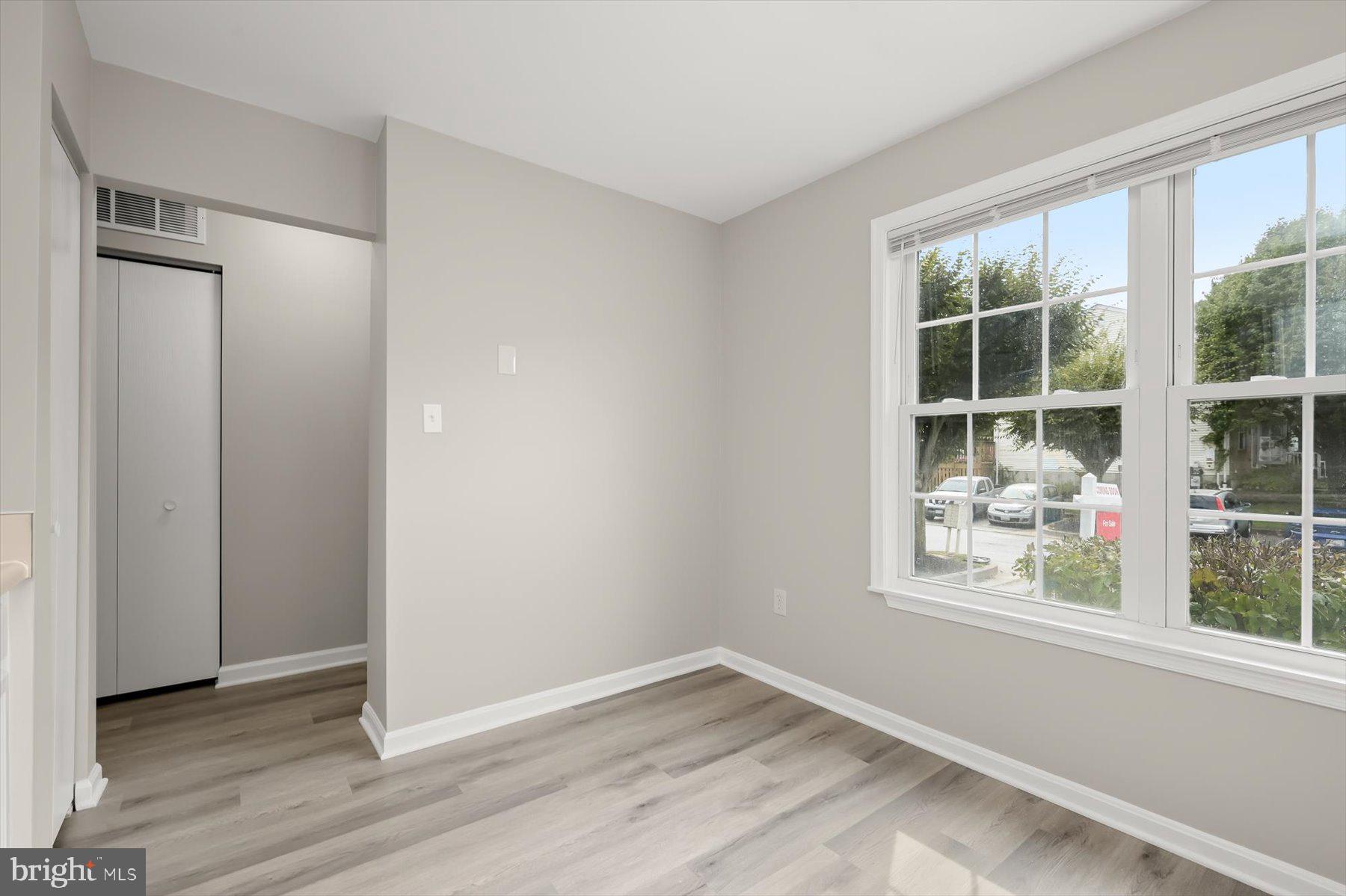17 Offspring Court Perry Hall, MD 21128 - Photo 16 of 42 an empty room with wooden floor and windows