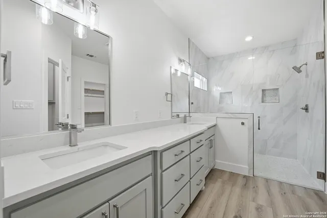 a bathroom with a sink and a mirror