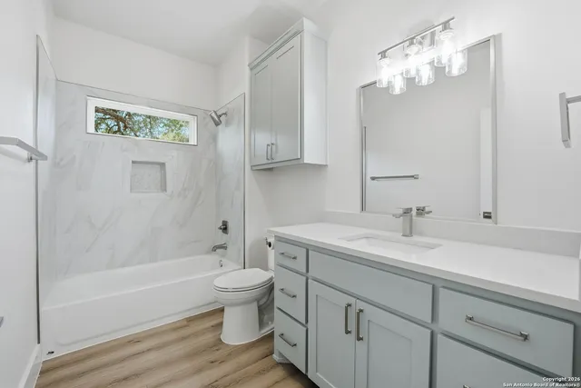 a bathroom with a bathtub and toilet