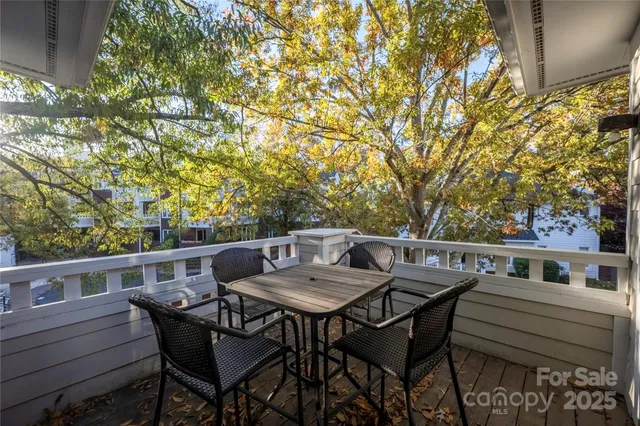a view of a chairs and table in the patio