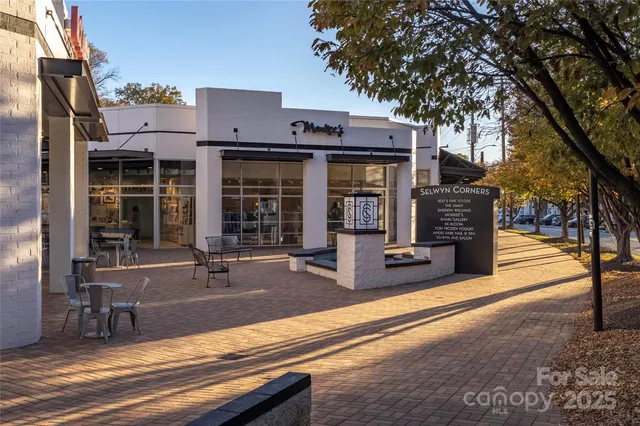 a view of a building with sitting area