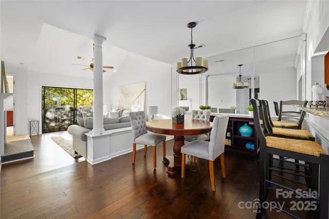 a view of a dining room with furniture and wooden floor