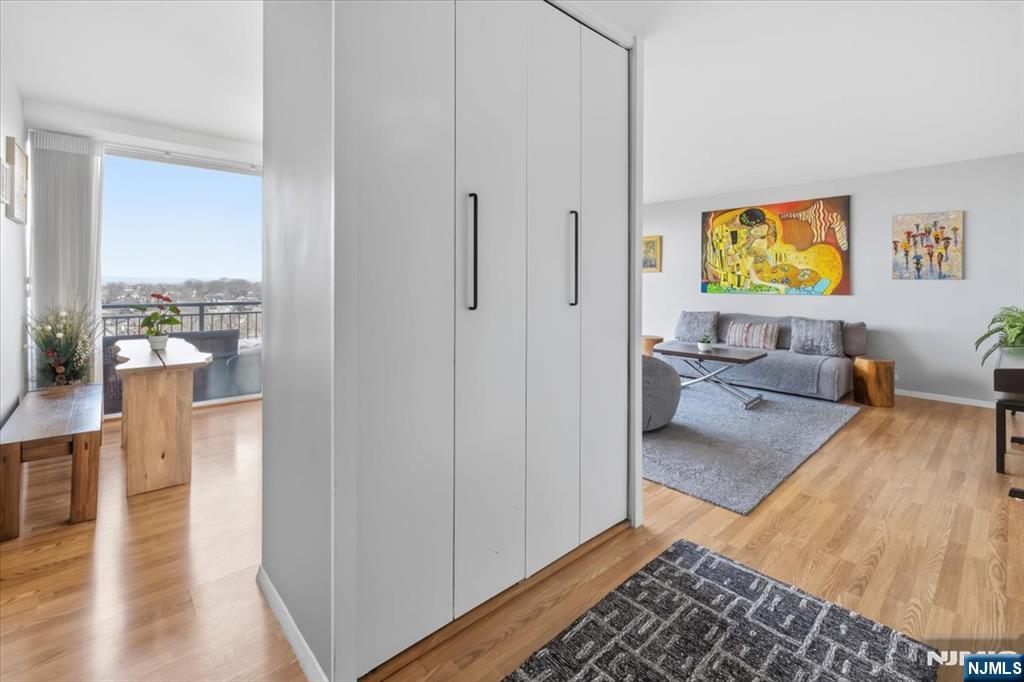 1 Horizon Road, Unit 1209 Fort Lee, NJ 07024 - Photo 2 of 15 a living room with furniture and a rug