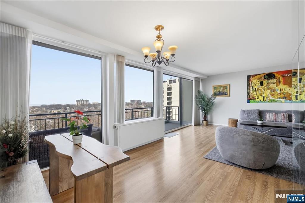 1 Horizon Road, Unit 1209 Fort Lee, NJ 07024 - Photo 5 of 15 a living room with furniture and a flat screen tv