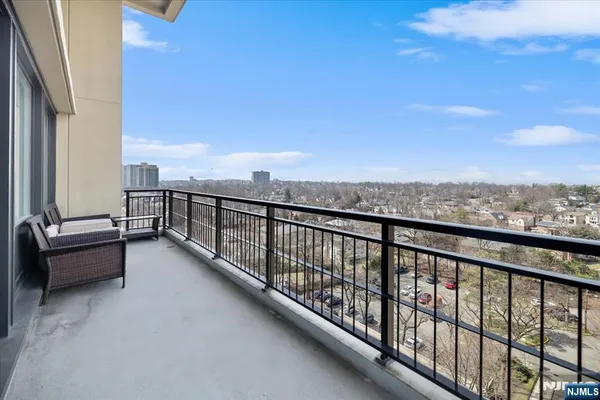 a view of balcony with furniture