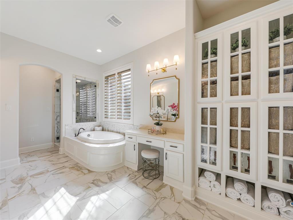 3117 Callander The Colony, TX 75056 - Photo 23 of 40 Primary bathroom has built-in linen closet, walk-in closet, laundry is right off of the walk in closet