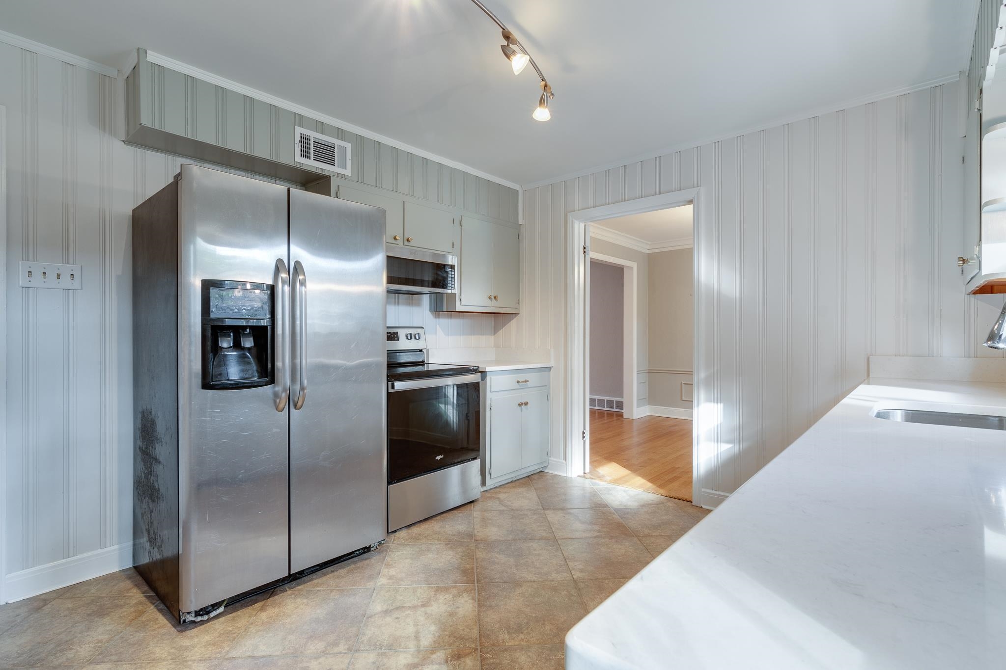 4165 Minden Road Memphis, TN 38117 - Photo 11 of 25 a kitchen with granite countertop a refrigerator and a sink