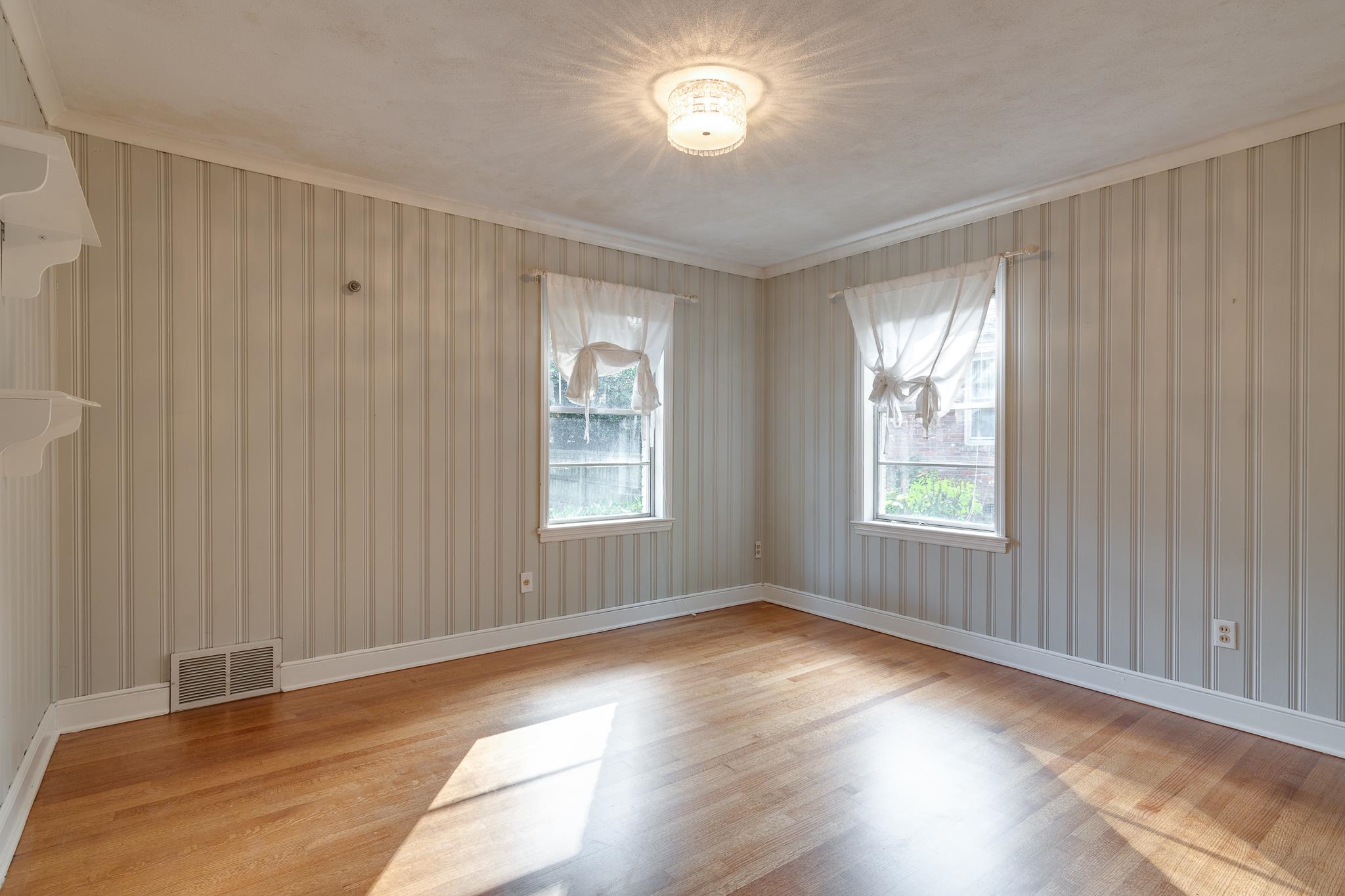 4165 Minden Road Memphis, TN 38117 - Photo 17 of 25 an empty room with wooden floor and windows